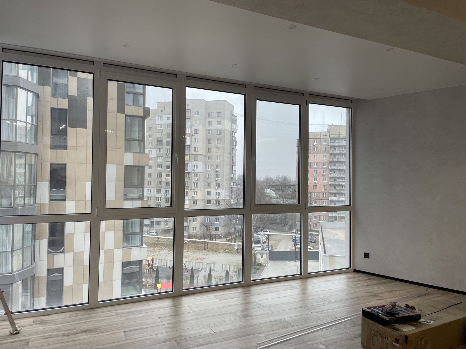 Living room before - bare panoramic windows