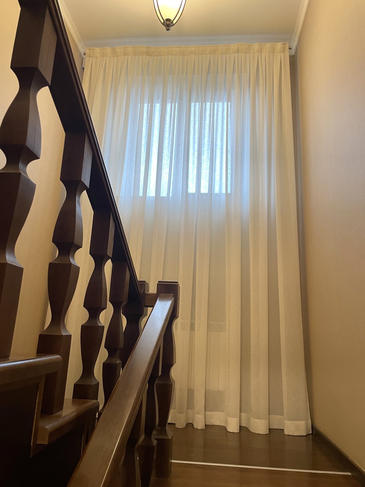 Staircase after - white voile curtain