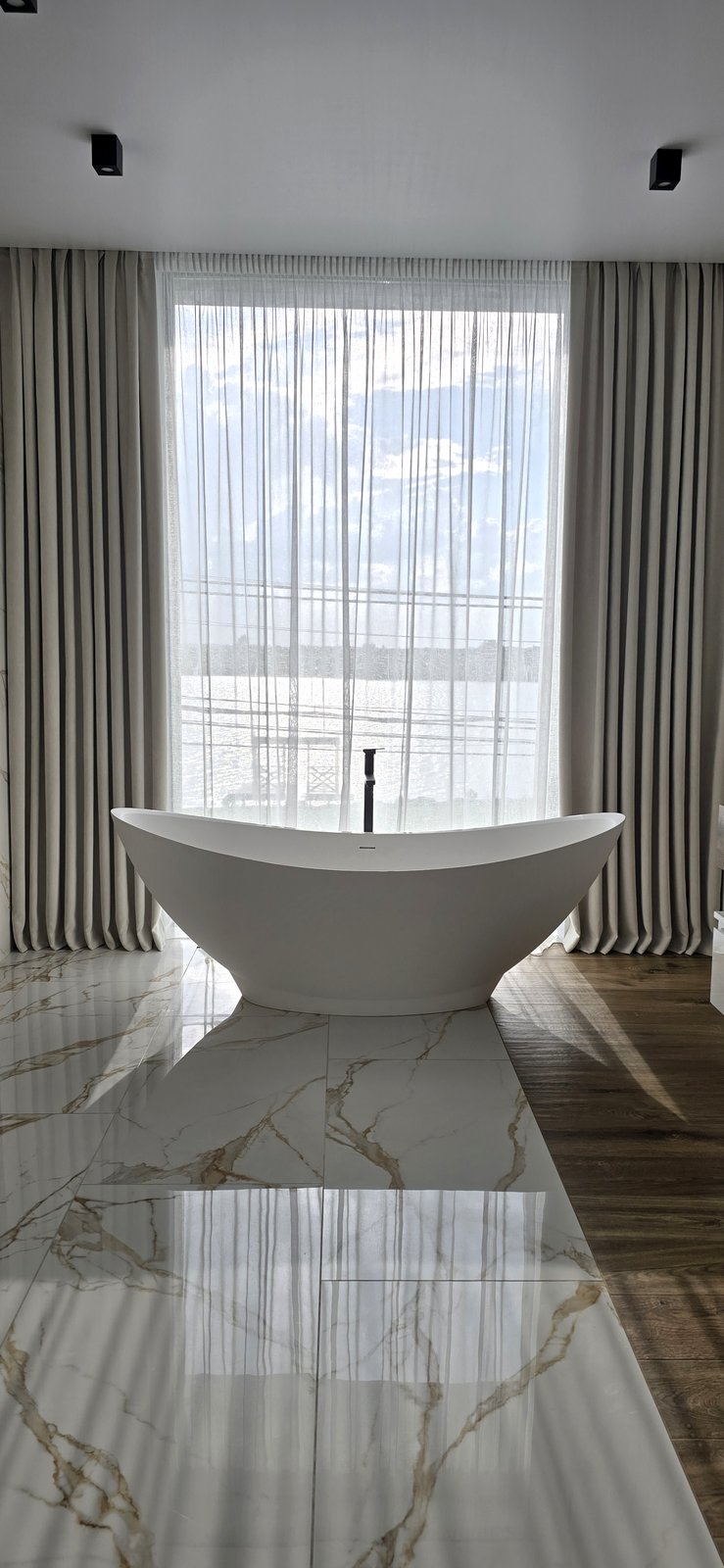 Luxury bathroom with panoramic curtains